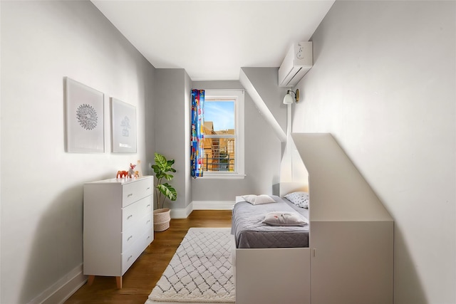 living area featuring a wall mounted AC and dark hardwood / wood-style floors