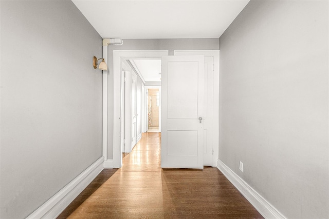 hallway featuring dark hardwood / wood-style floors