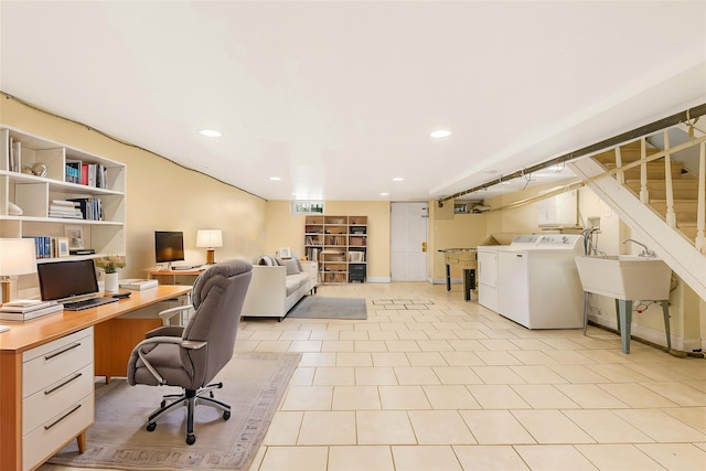 office area with built in features, separate washer and dryer, sink, and light tile patterned floors