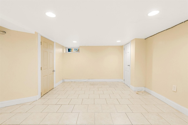 basement featuring light tile patterned flooring