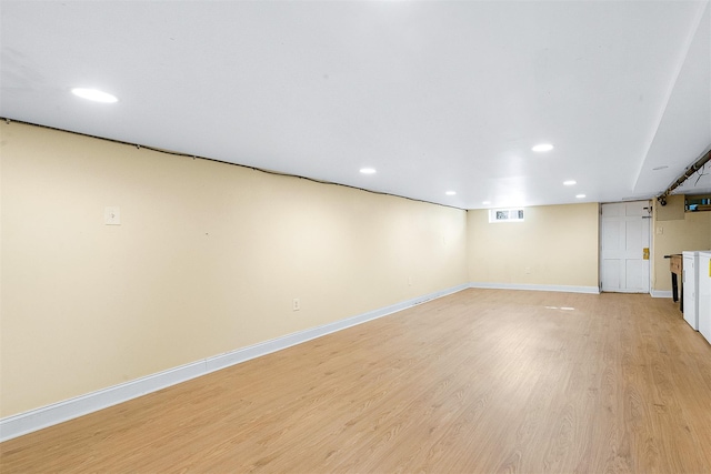 basement with light hardwood / wood-style floors