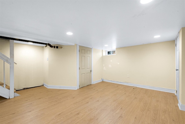 basement featuring light hardwood / wood-style flooring