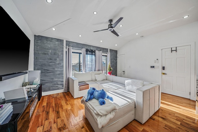 bedroom featuring light hardwood / wood-style flooring, ceiling fan, and lofted ceiling