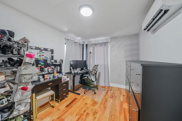 office area featuring light hardwood / wood-style floors and a wall mounted AC