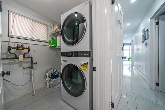 laundry room with stacked washer and clothes dryer