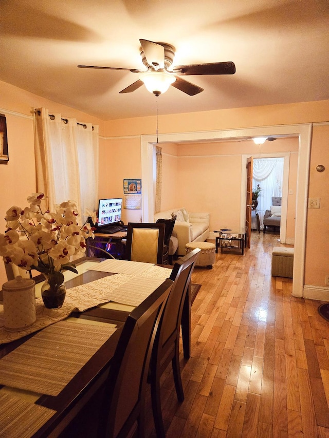 dining room with hardwood / wood-style floors and ceiling fan