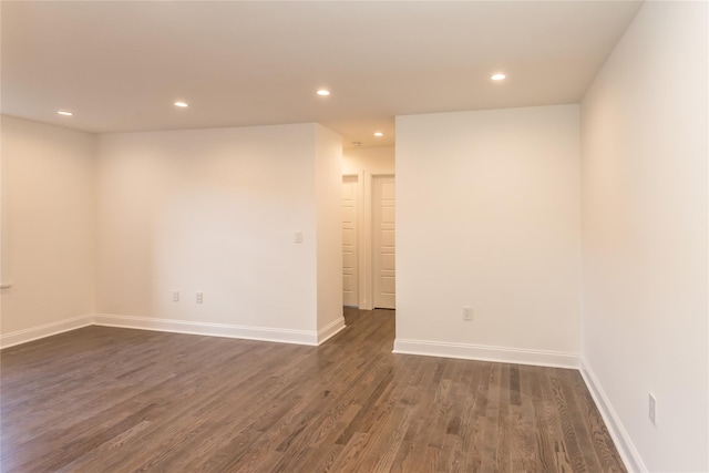 spare room featuring dark hardwood / wood-style flooring