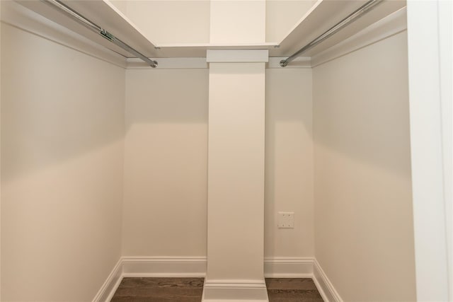 spacious closet with dark hardwood / wood-style floors