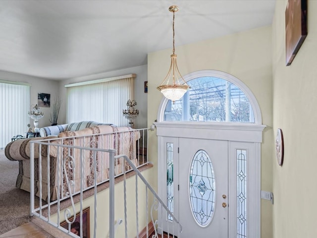 view of carpeted foyer