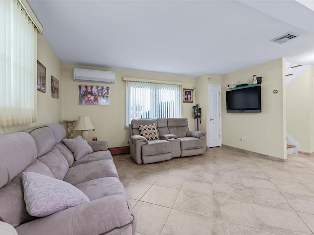 tiled living room featuring a wall mounted air conditioner