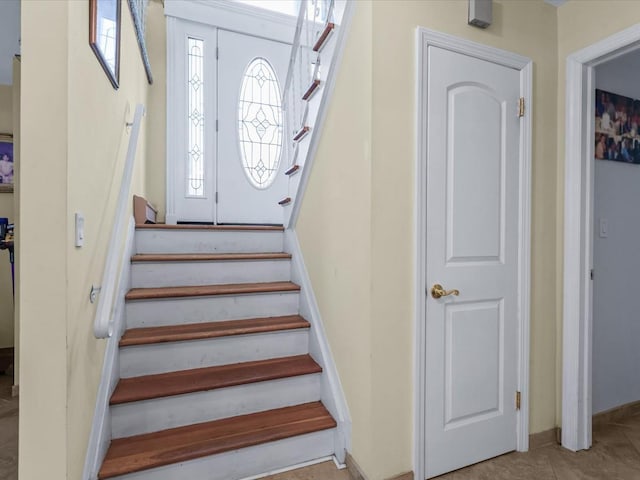 stairs with tile patterned flooring and plenty of natural light