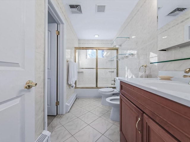 full bathroom with baseboard heating, a bidet, toilet, shower / bath combination with glass door, and vanity