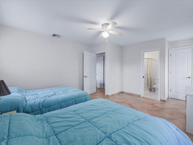 bedroom featuring ceiling fan and ensuite bath