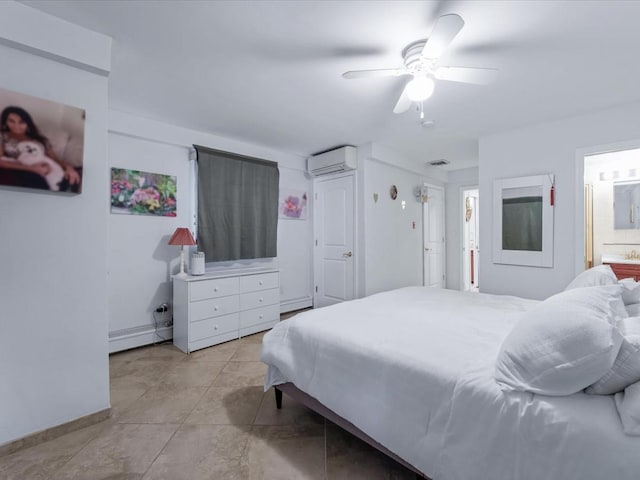 bedroom featuring a wall mounted air conditioner, ensuite bathroom, ceiling fan, baseboard heating, and light tile patterned flooring