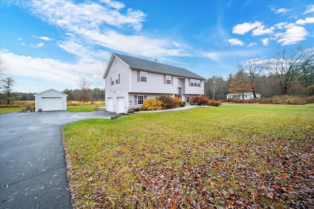 view of side of home with a garage and a lawn