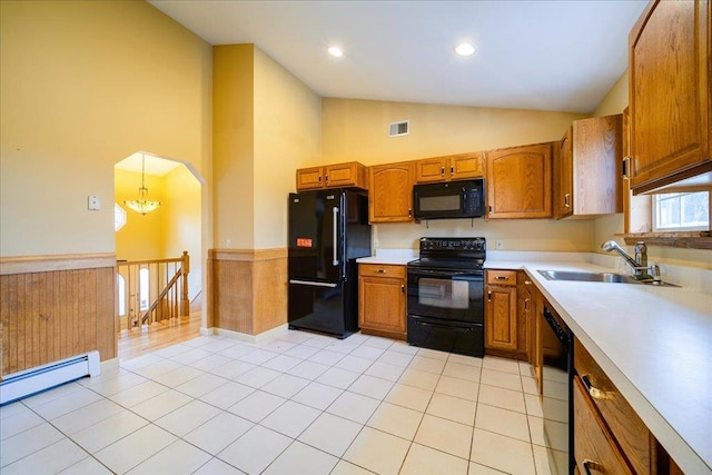 kitchen featuring sink, black appliances, light tile patterned floors, pendant lighting, and high vaulted ceiling