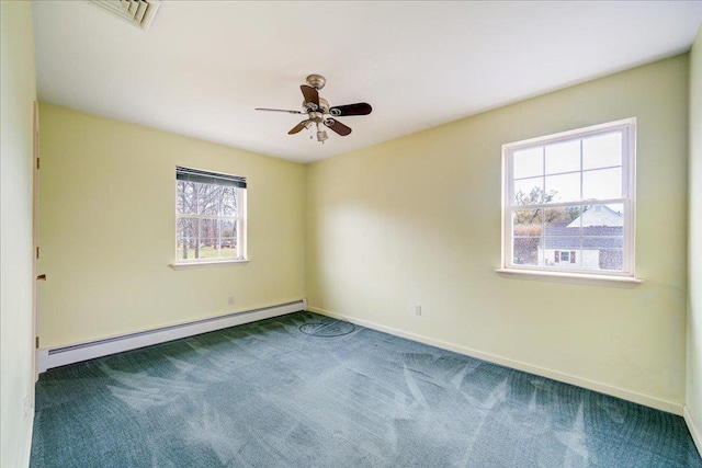 carpeted empty room featuring a baseboard radiator, ceiling fan, and a healthy amount of sunlight