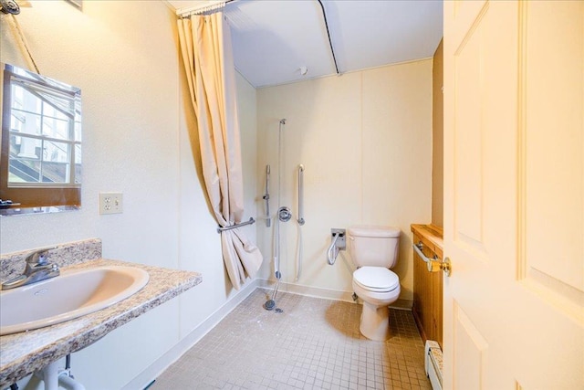 bathroom featuring tile patterned floors, a shower with curtain, sink, toilet, and baseboard heating