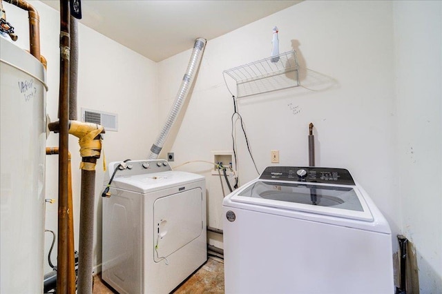 laundry room featuring separate washer and dryer