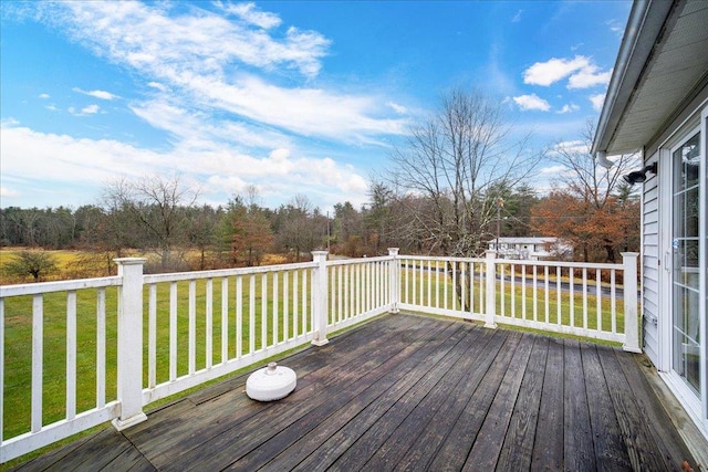 wooden terrace with a yard