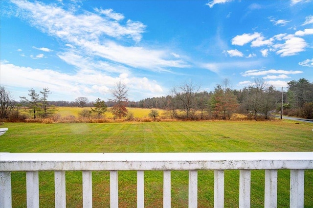 view of yard with a rural view