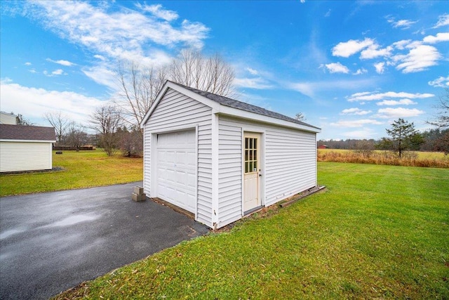 garage with a lawn