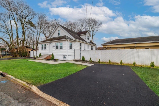 rear view of house with a lawn