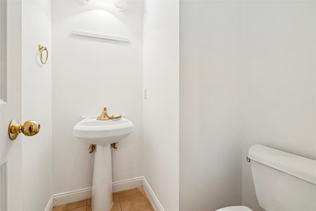 bathroom featuring tile patterned floors and toilet