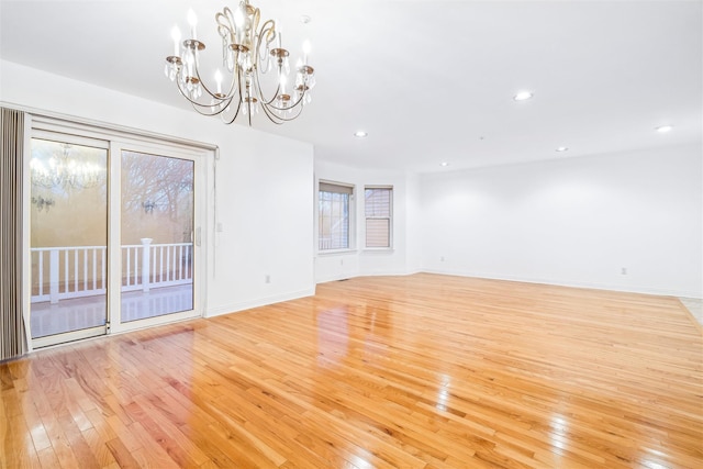 interior space with light hardwood / wood-style flooring and a chandelier