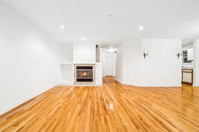 unfurnished living room with light wood-type flooring