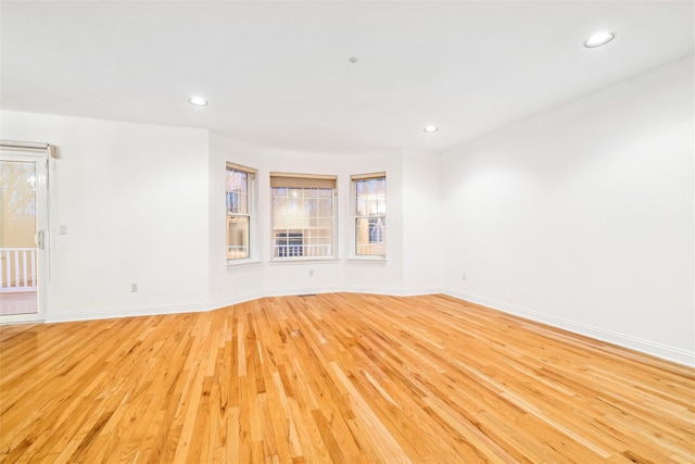 spare room featuring light hardwood / wood-style flooring