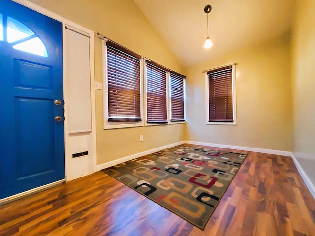 entrance foyer with wood-type flooring and lofted ceiling