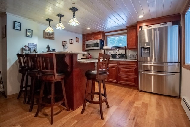 bar featuring stainless steel appliances, baseboard heating, wooden ceiling, light hardwood / wood-style floors, and hanging light fixtures