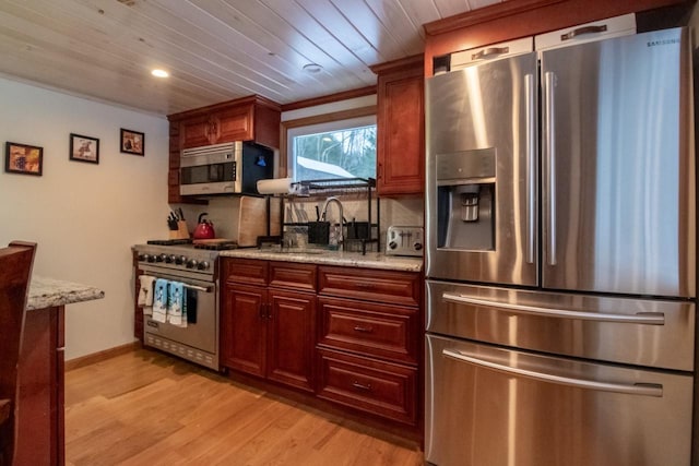 kitchen featuring light stone countertops, sink, wooden ceiling, stainless steel appliances, and light hardwood / wood-style flooring