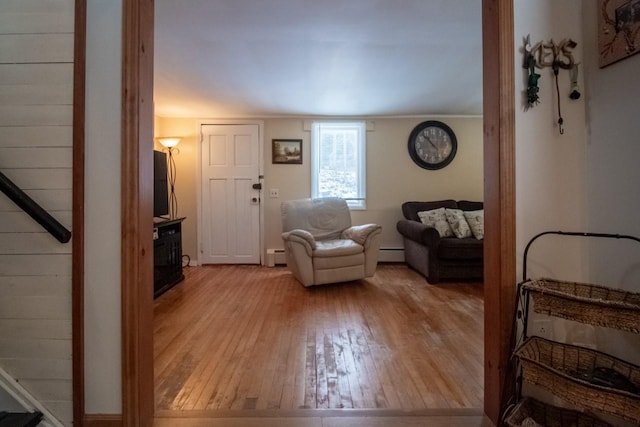 living room featuring light hardwood / wood-style floors and a baseboard radiator