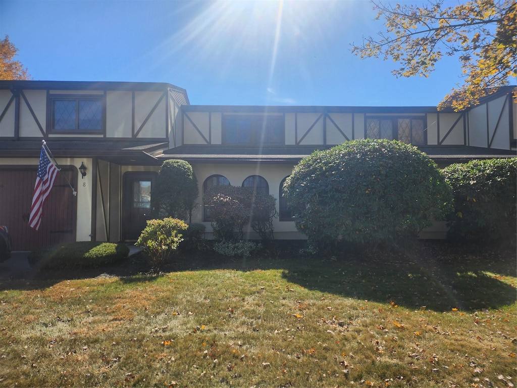 rear view of property with a yard