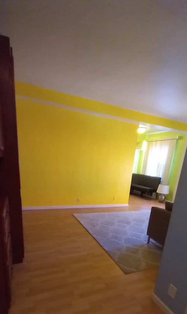 empty room featuring wood-type flooring