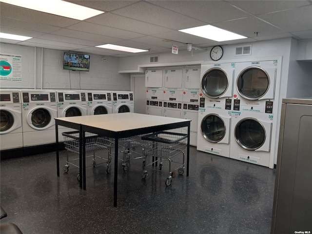 laundry area with separate washer and dryer and stacked washer and clothes dryer