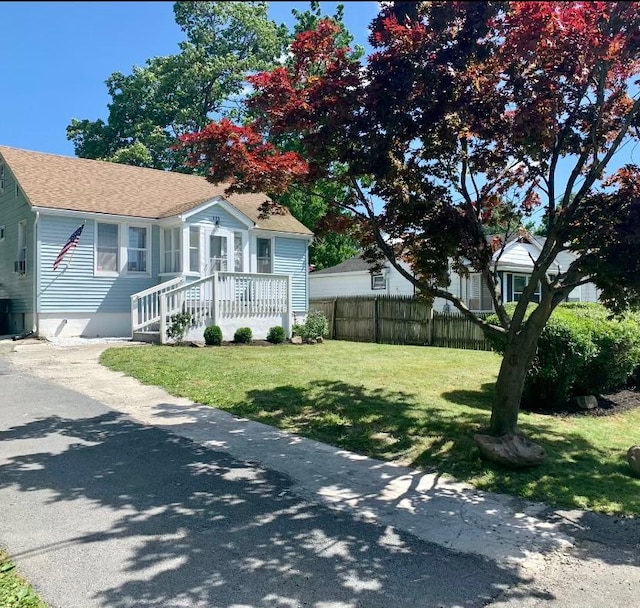 bungalow with a front yard