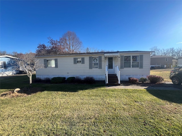 ranch-style home with a front lawn