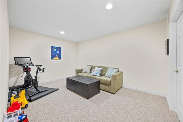 exercise room with light colored carpet