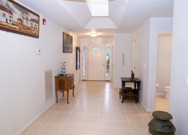 entryway featuring light tile patterned flooring