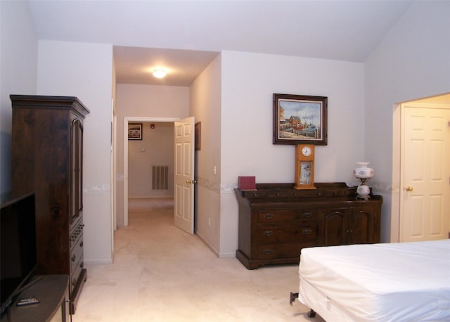 bedroom featuring light carpet