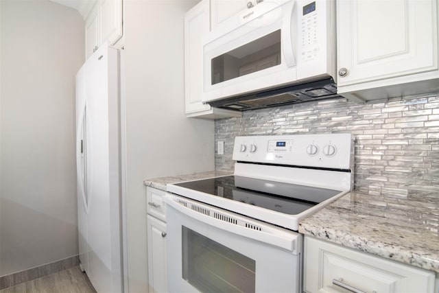 kitchen featuring white cabinets, white appliances, and backsplash