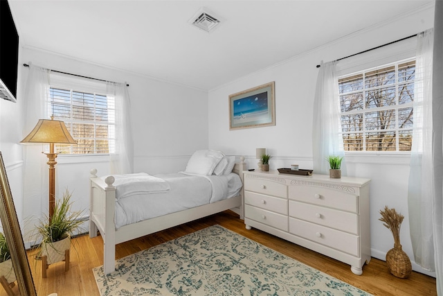 bedroom with light wood-type flooring