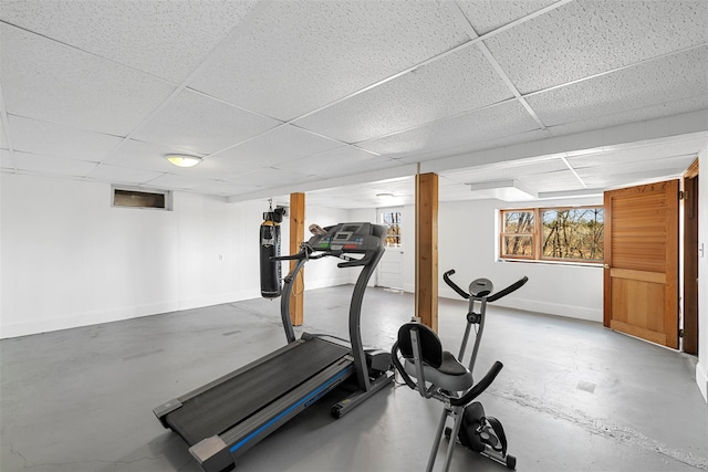 exercise room featuring a drop ceiling