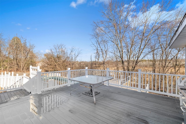 wooden deck featuring a pool