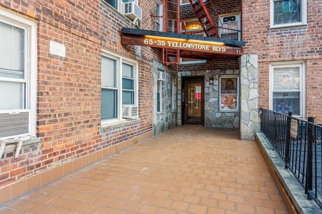 65-35 Yellowstone Blvd Unit 2H, Forest Hills, NY 11375 - doorway to property featuring a balcony and brick siding