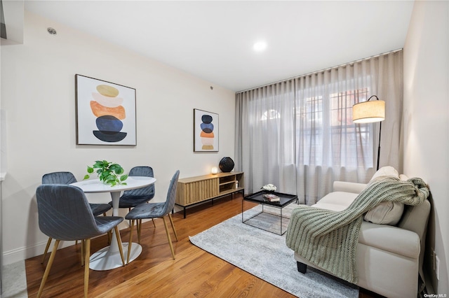 living area with hardwood / wood-style floors