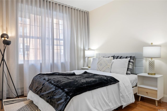 bedroom with wood-type flooring